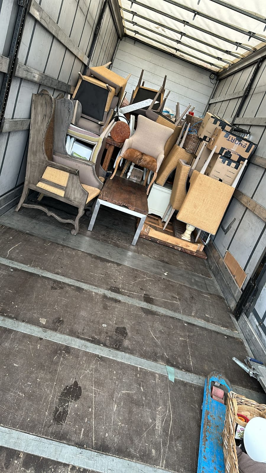 Chairs and furniture loaded in a removal truck
